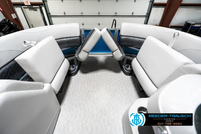 Slide: The Image of 2025 Avalon 2285 LSZ CRB boat interior with plush seating and cup holders. - 22