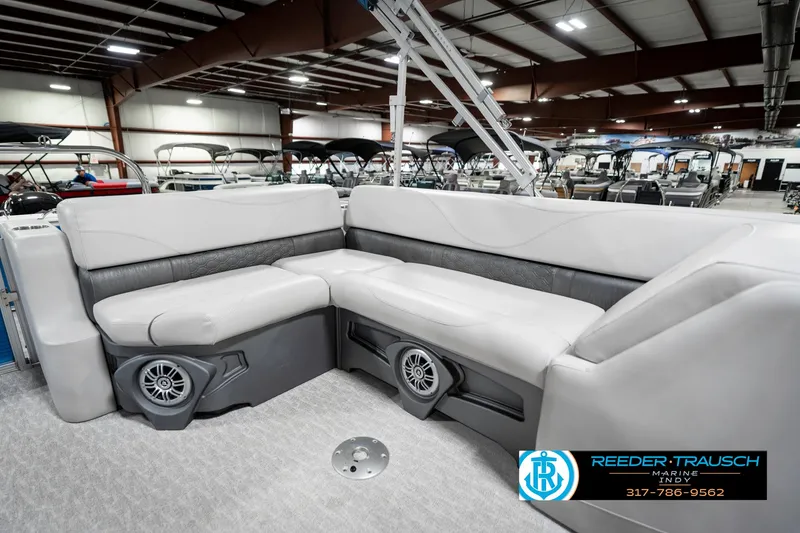 Slide: The Image of 2025 Avalon 2285 LSZ CRB pontoon boat interior with plush seating and built-in speakers. - 26