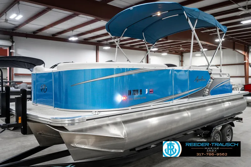 Slide: The Image of 2025 Avalon 2285 LSZ CRB pontoon boat with blue exterior in showroom. - 3