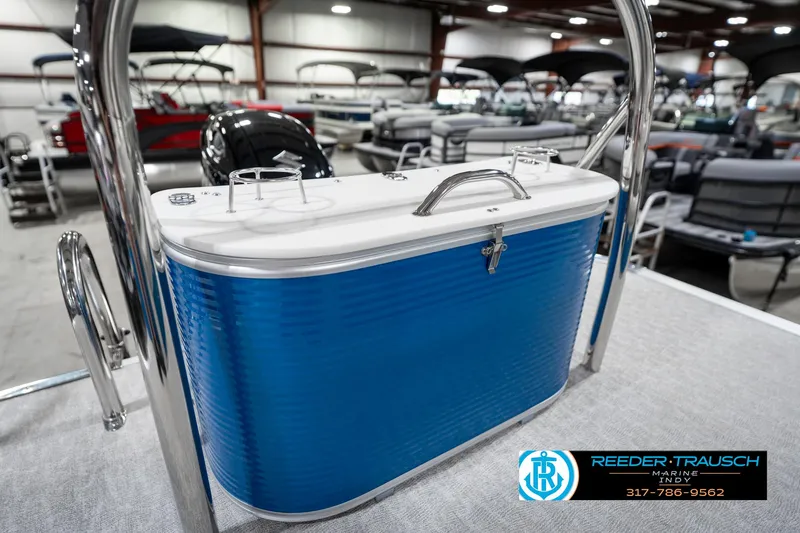 Slide: The Image of 2025 Avalon 2285 LSZ CRB boat with blue cooler in showroom. - 31