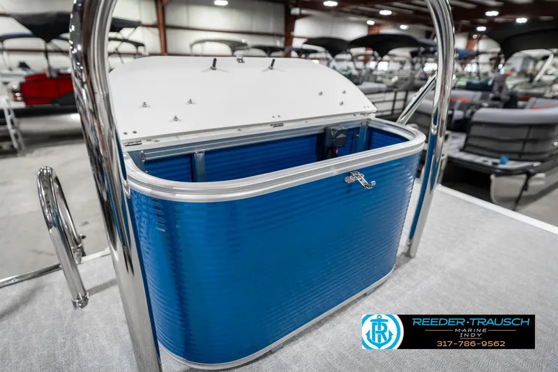 Slide: The Image of 2025 Avalon 2285 LSZ CRB pontoon boat with blue storage compartment in showroom. - 32