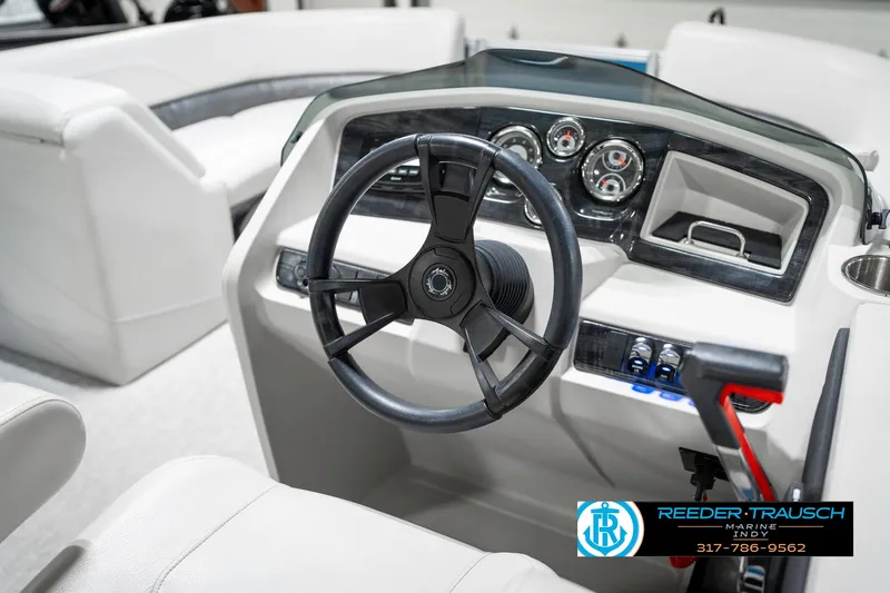 Slide: The Image of 2025 Avalon 2285 LSZ CRB boat dashboard with steering wheel and controls. - 33