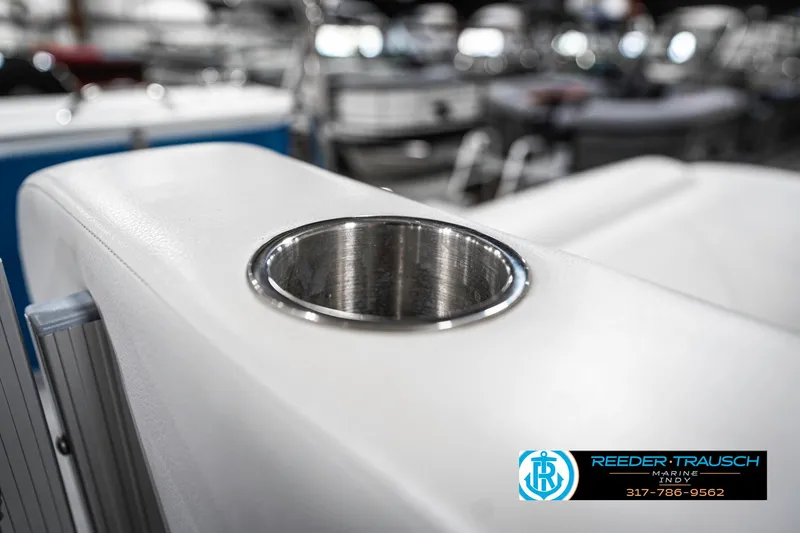 Slide: The Image of 2025 Avalon 2285 LSZ CRB boat cup holder detail, Reeder-Trausch Marine logo visible. - 48