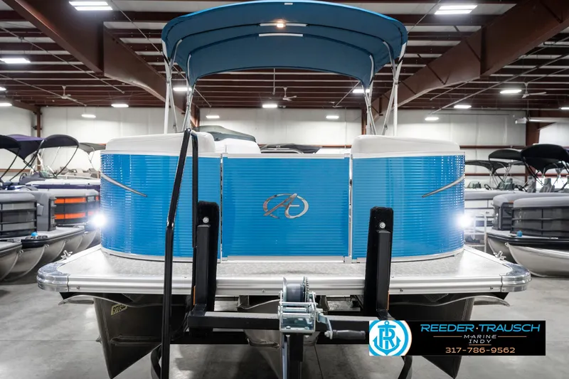 Slide: The Image of 2025 Avalon 2285 LSZ CRB pontoon boat in showroom, blue exterior, front view. - 5