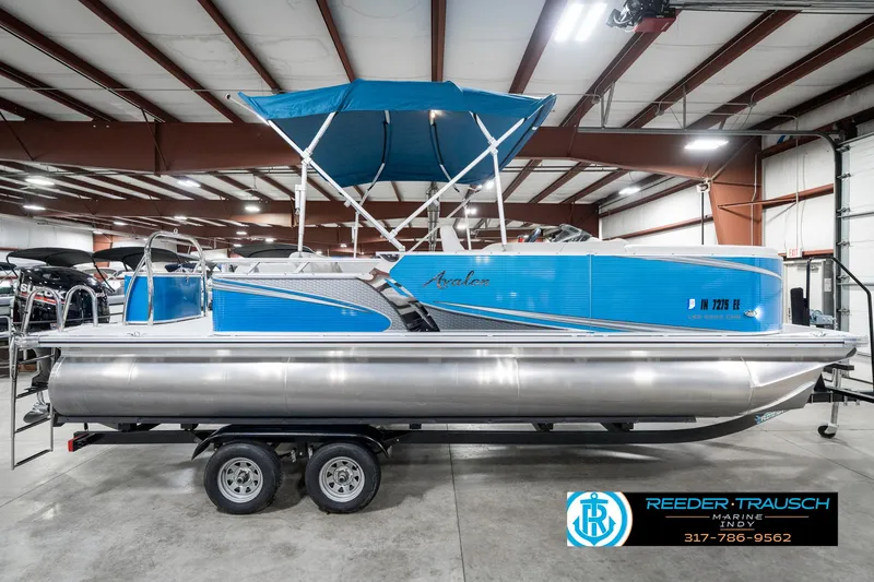Slide: The Image of 2025 Avalon 2285 LSZ CRB pontoon boat with blue canopy in showroom. - 7