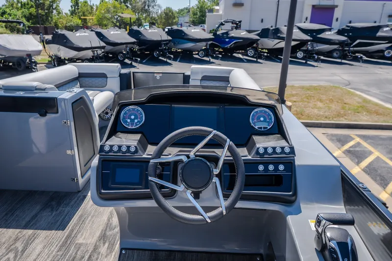 Slide: The Image of Interior view of 2021 Godfrey Sanpan 2400 ULC boat dashboard with steering wheel. - 19