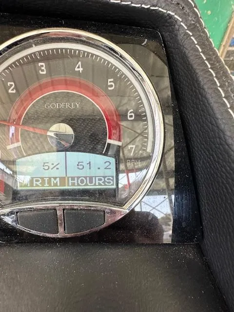Slide: The Image of Close-up of 2021 Godfrey Sanpan 2400 ULC dashboard gauge displaying RPM and hours. - 10