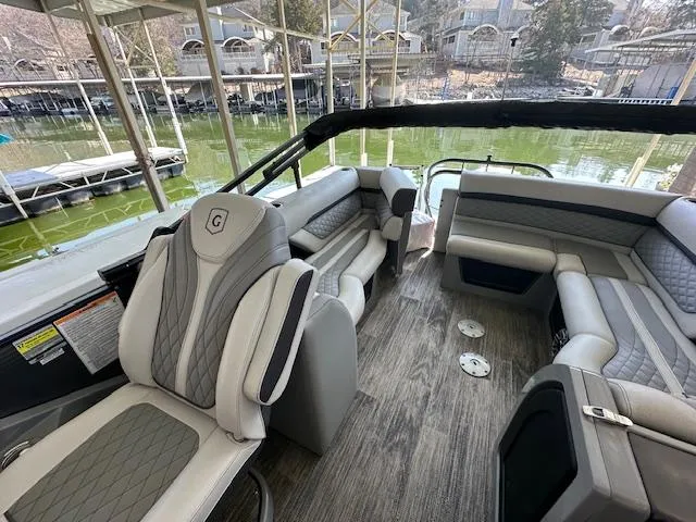 Slide: The Image of Luxurious 2021 Godfrey Sanpan 2400 ULC pontoon boat interior with plush seating and elegant design. - 3