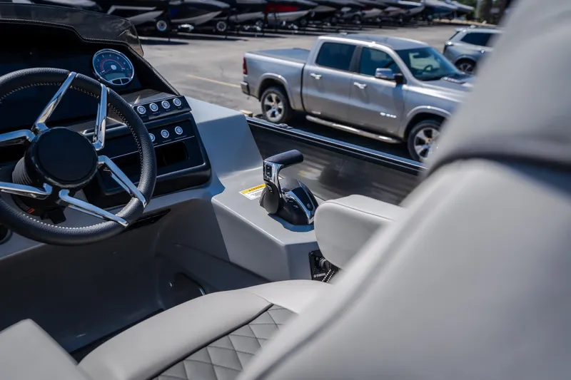 Slide: The Image of Interior view of 2021 Godfrey Sanpan 2400 ULC boat with steering wheel and controls. - 17