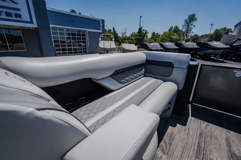 Slide: The Image of Luxurious seating on 2021 Godfrey Sanpan 2400 ULC pontoon boat, featuring elegant gray upholstery. - 23