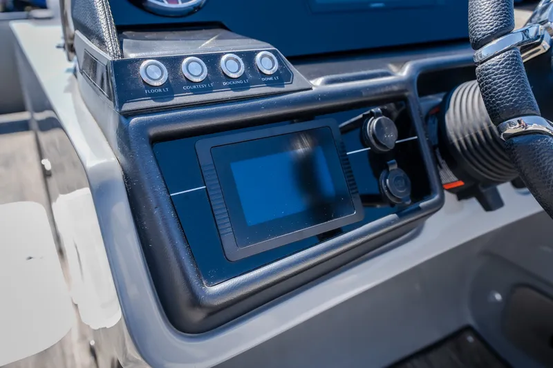 Slide: The Image of Dashboard of 2021 Godfrey Sanpan 2400 ULC boat with control panel and steering wheel. - 21