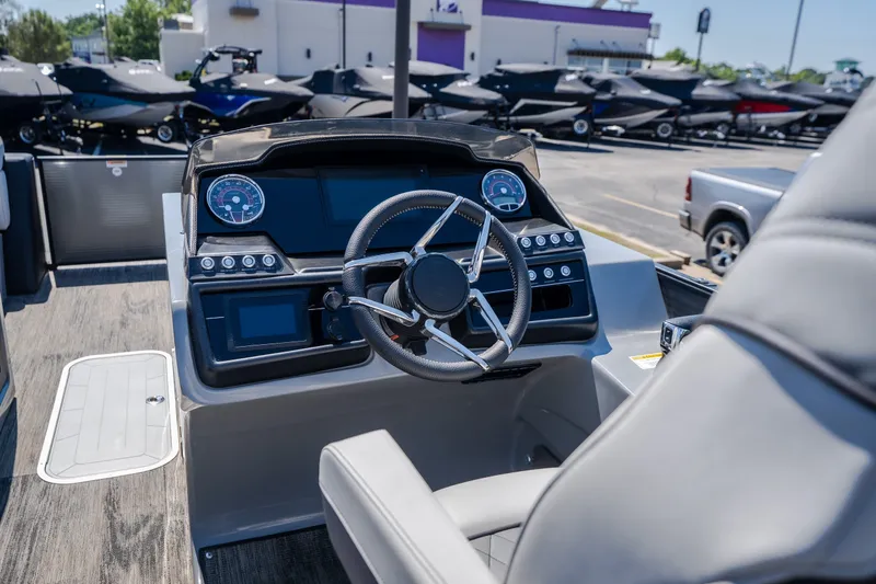Slide: The Image of Interior view of 2021 Godfrey Sanpan 2400 ULC boat dashboard and steering wheel. - 16