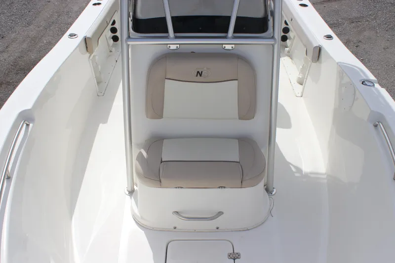 Slide: The Image of 2016 NauticStar 20 XS Offshore boat interior with cushioned seating and console. - 14