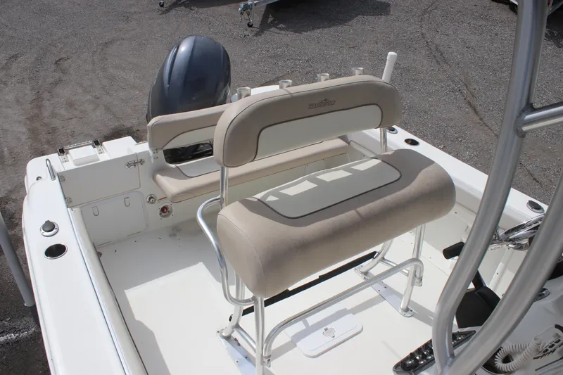 Slide: The Image of 2016 NauticStar 20 XS Offshore boat interior with seating and motor. - 15