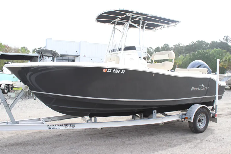 Slide: The Image of 2016 NauticStar 20 XS Offshore boat on trailer, side view. - 2