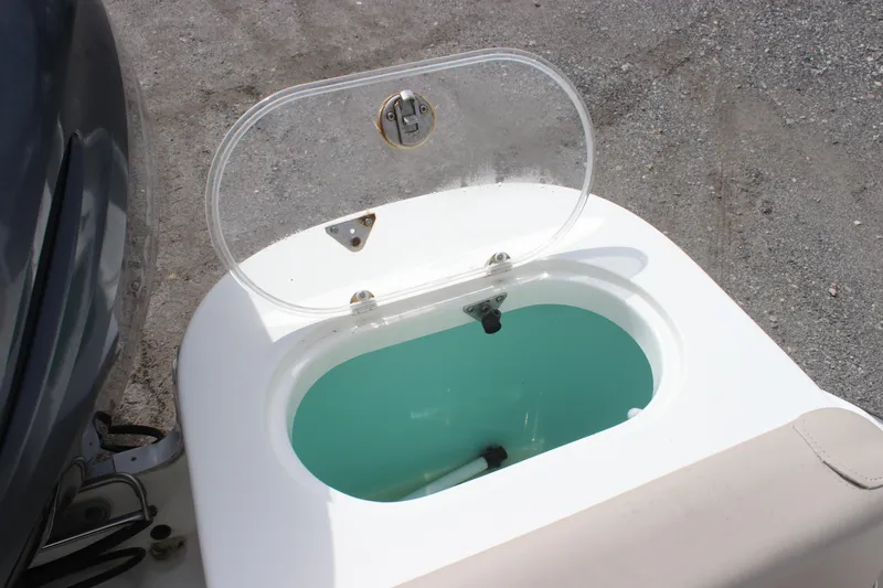 Slide: The Image of Open livewell on 2016 NauticStar 20 XS Offshore boat, showing interior. - 22