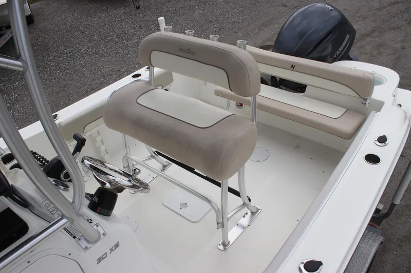 Slide: The Image of 2016 NauticStar 20 XS Offshore boat interior with seating and steering wheel. - 23