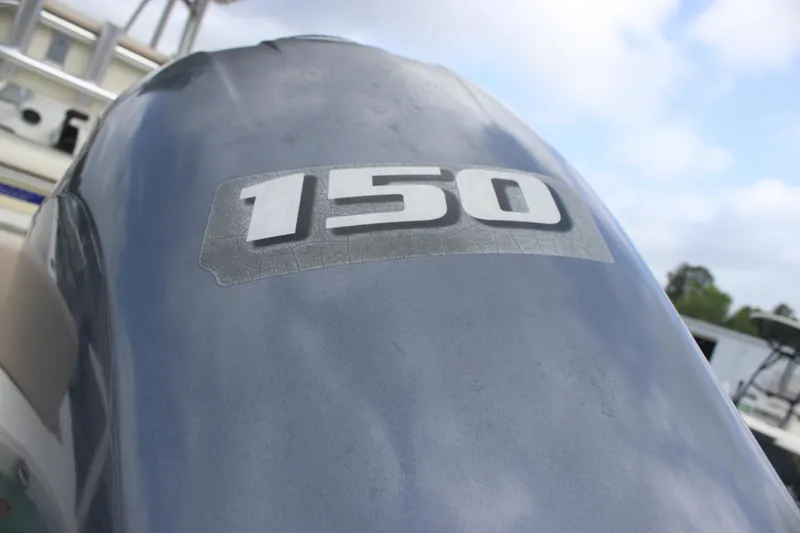 Slide: The Image of Outboard motor with "150" label on a 2016 NauticStar 20 XS Offshore boat. - 7