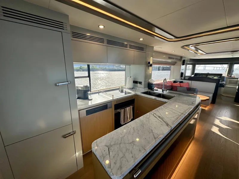 Slide: The Image of Luxurious interior of 2024 Sirena 68 yacht with modern kitchen and elegant marble countertops. - 12