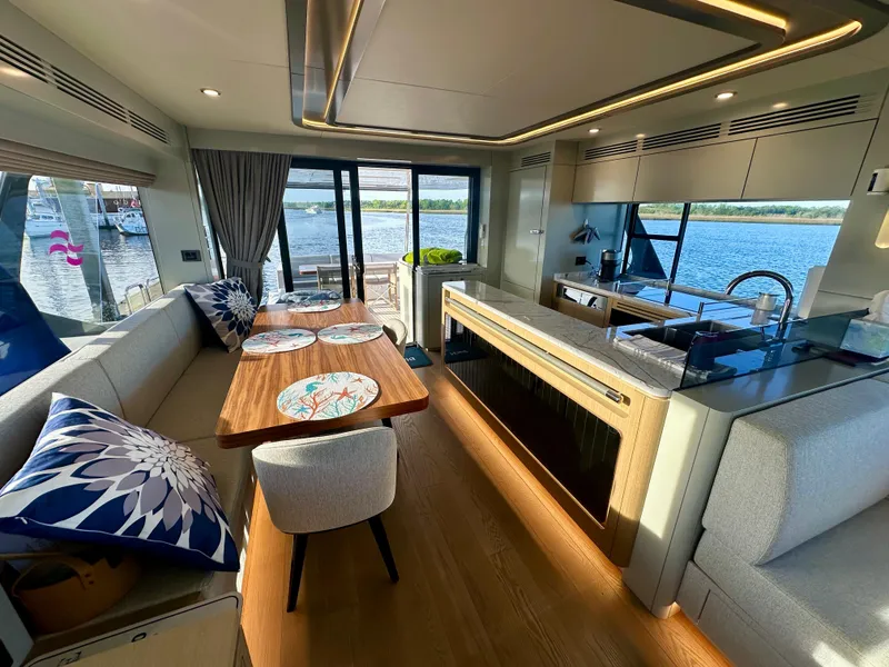 Slide: The Image of Luxurious interior of 2024 Sirena 68 yacht with elegant dining and kitchen area. - 15