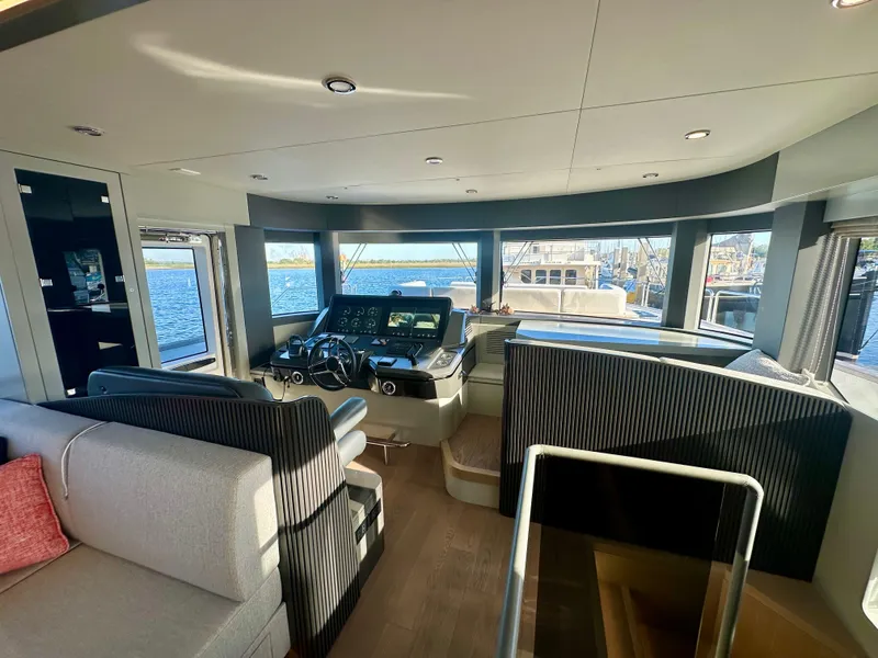 Slide: The Image of Luxurious interior of 2024 Sirena 68 yacht with panoramic windows and modern helm. - 18