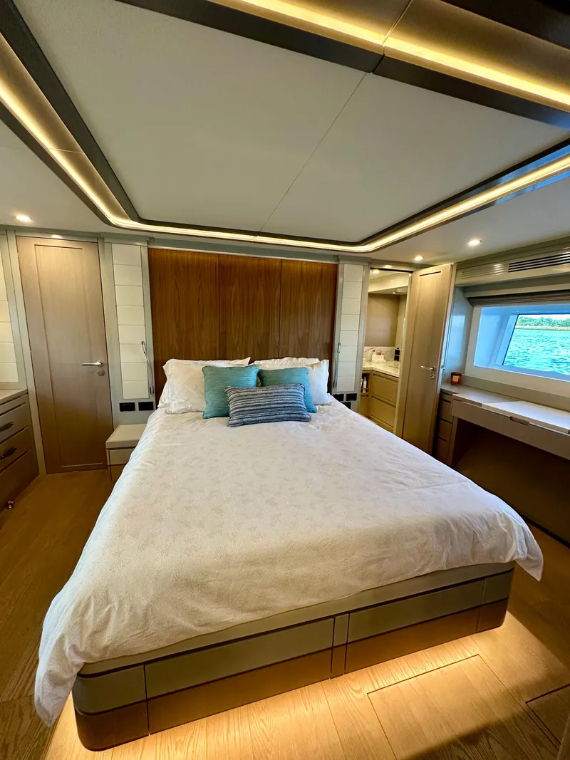 Slide: The Image of Luxurious bedroom interior of 2024 Sirena 68 yacht with modern design and large window view. - 21