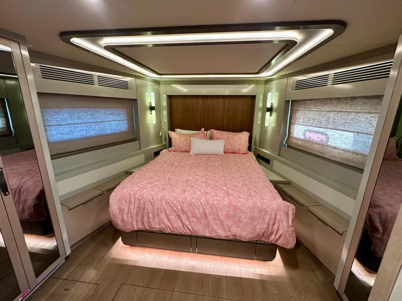 Slide: The Image of Luxurious bedroom interior of 2024 Sirena 68 yacht with modern lighting and cozy bedding. - 25