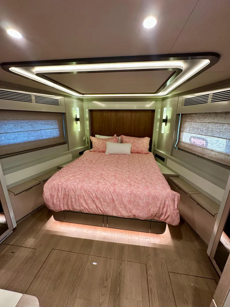 Slide: The Image of Luxurious 2024 Sirena 68 yacht bedroom with modern lighting and elegant decor. - 26