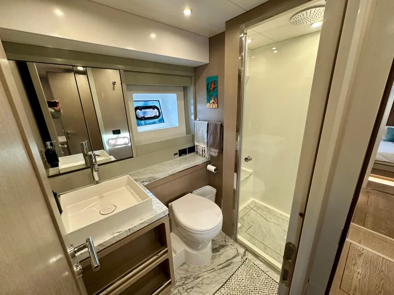 Slide: The Image of Luxurious bathroom in 2024 Sirena 68 yacht with modern fixtures and elegant design. - 28