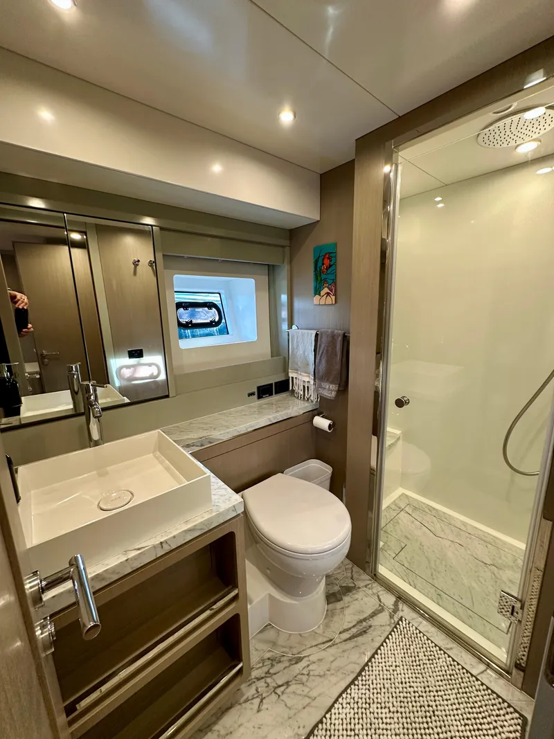 Slide: The Image of Luxurious bathroom in 2024 Sirena 68 yacht with modern fixtures and marble accents. - 31