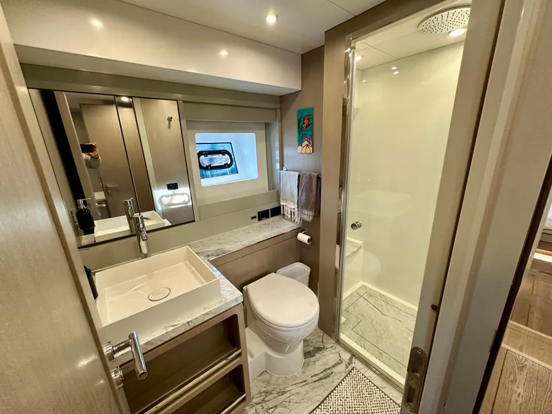 Slide: The Image of Luxurious bathroom in 2024 Sirena 68 yacht, featuring modern fixtures and elegant marble accents. - 33
