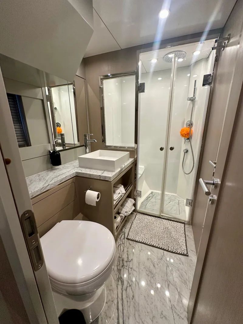 Slide: The Image of Luxurious bathroom in 2024 Sirena 68 yacht with modern fixtures and marble flooring. - 35