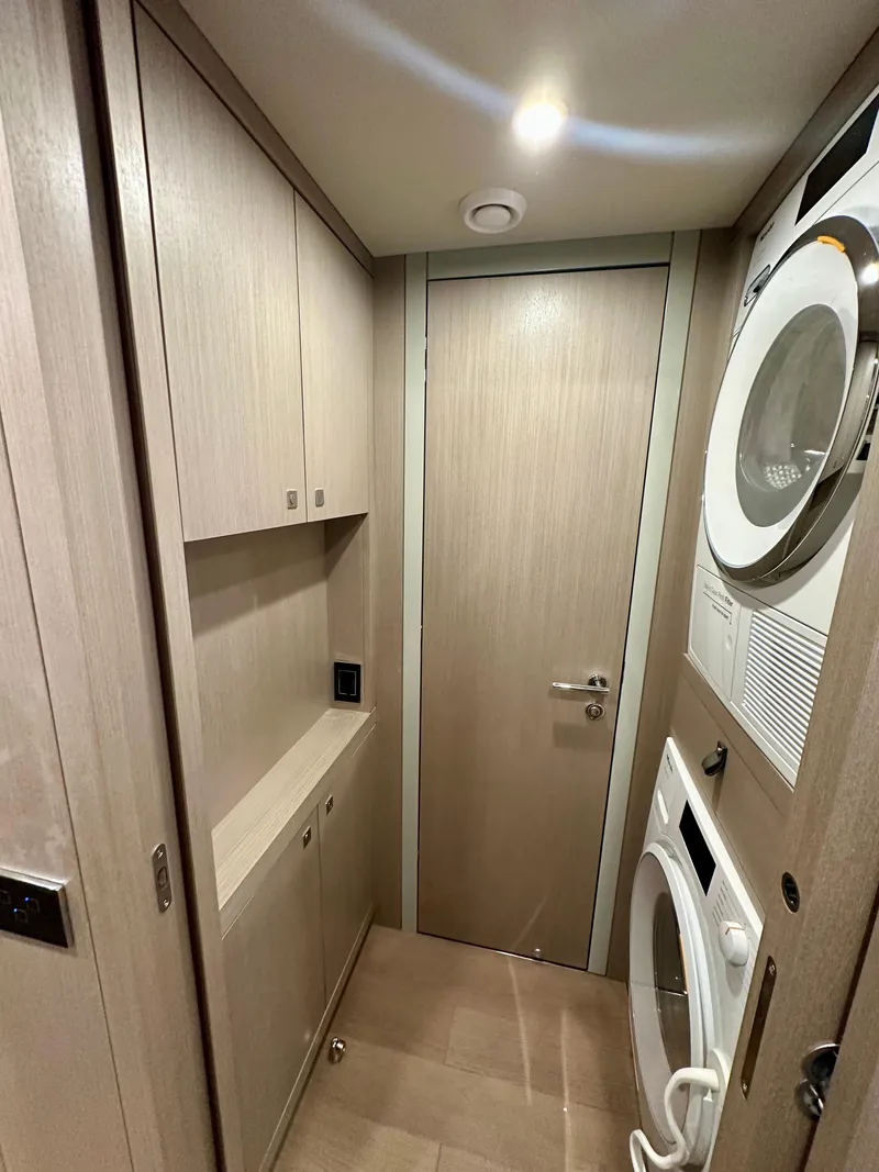 Slide: The Image of Laundry room in 2024 Sirena 68 yacht with stacked washer and dryer. - 40