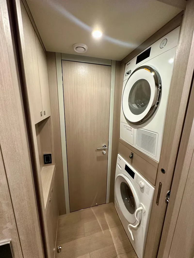Slide: The Image of Laundry area in 2024 Sirena 68 yacht with stacked washer and dryer. - 41