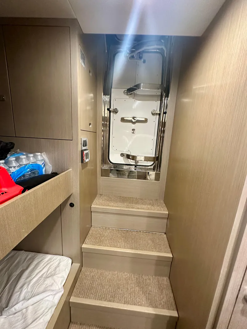 Slide: The Image of Interior stairs of 2024 Sirena 68 yacht with modern design and storage. - 46