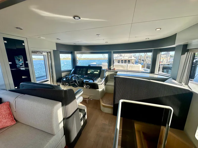 Slide: The Image of Luxurious interior of 2024 Sirena 68 yacht with modern helm and panoramic windows. - 9