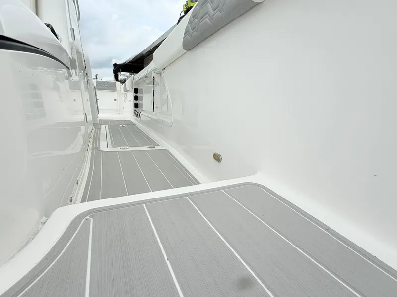 Slide: The Image of 2022 Twin Vee 280 GFX CC boat deck with gray non-slip flooring. - 15