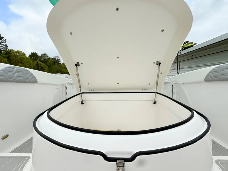 Slide: The Image of Open storage compartment on 2022 Twin Vee 280 GFX CC boat. - 17