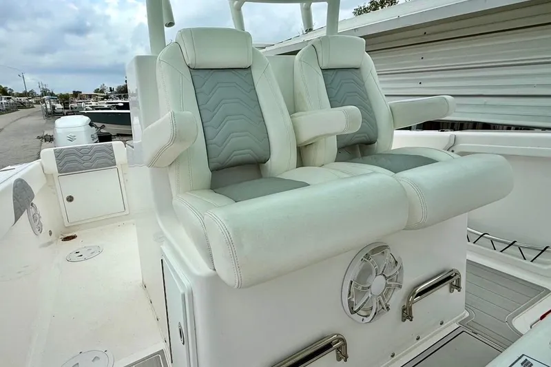 Slide: The Image of 2022 Twin Vee 280 GFX CC boat with dual cushioned seats and speaker system. - 27