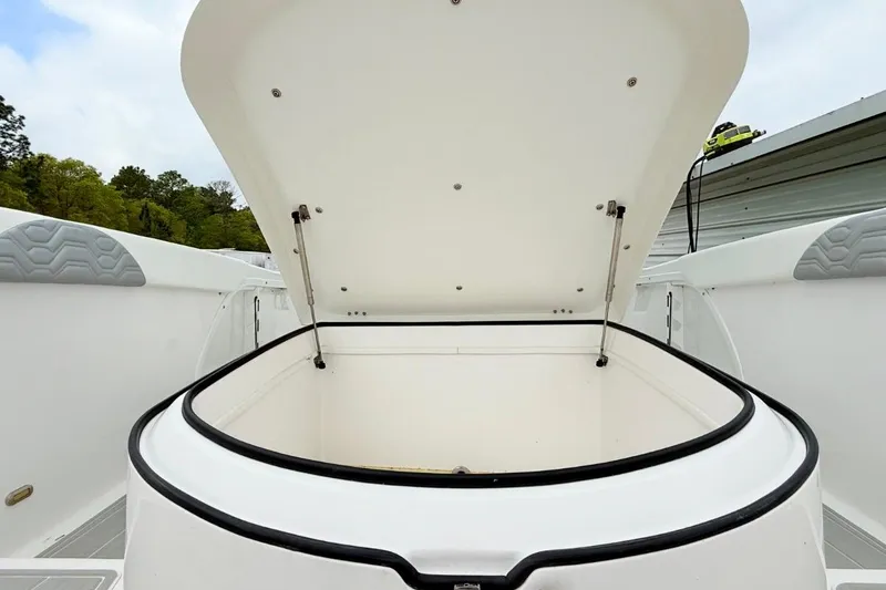 Slide: The Image of Open storage compartment on 2022 Twin Vee 280 GFX CC boat. - 33