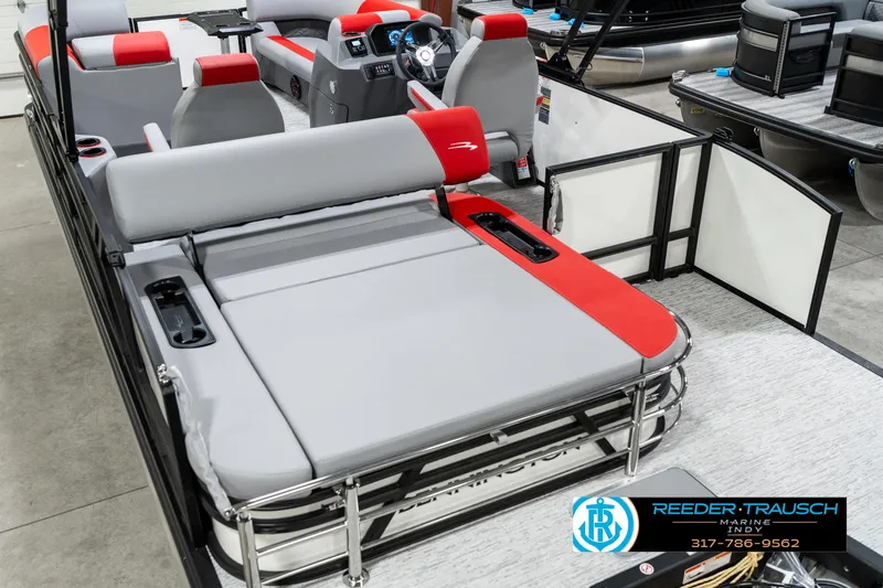 Slide: The Image of 2025 Bennington 21 SSB pontoon boat interior with red and gray seating. - 15