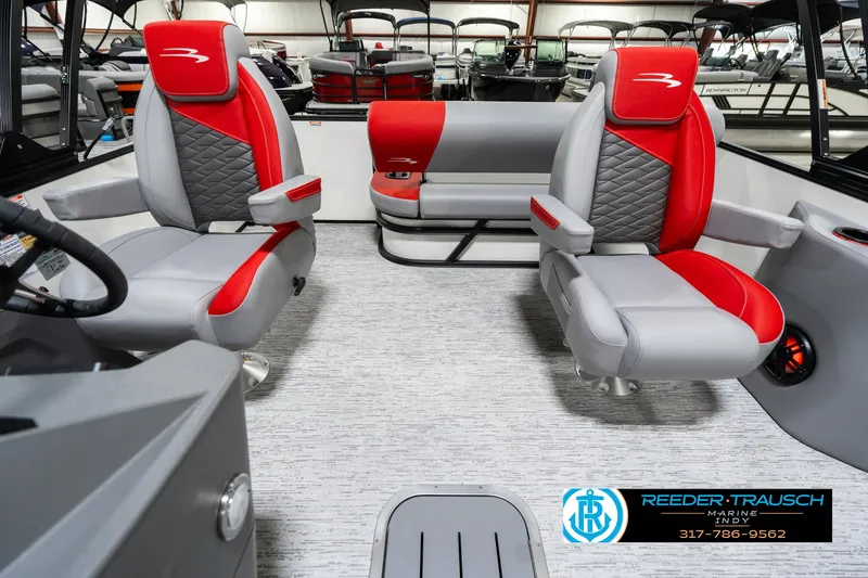 Slide: The Image of 2025 Bennington 21 SSB boat interior with red and gray seating, modern design. - 17