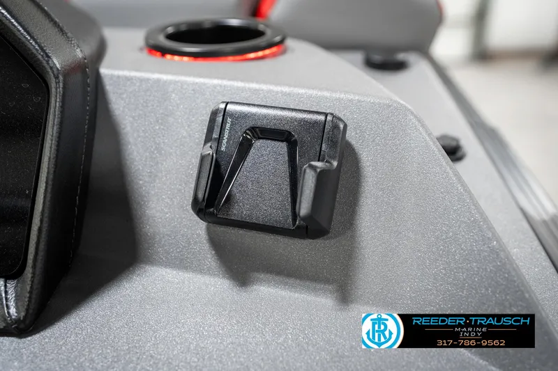 Slide: The Image of 2025 Bennington 21 SSB boat dashboard detail with cup holder and control panel. - 38