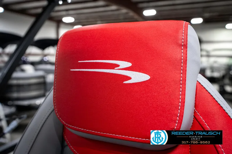 Slide: The Image of Red Bennington 21 SSB 2025 boat seat with logo, showcased indoors. - 45