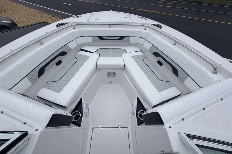 Slide: The Image of 2025 Blackfin 252 DC boat interior with luxurious white seating and modern design. - 10