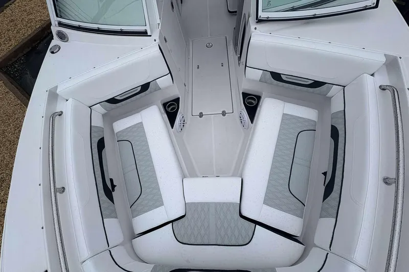 Slide: The Image of 2025 Blackfin 252 DC boat interior with white cushioned seating and modern design. - 13