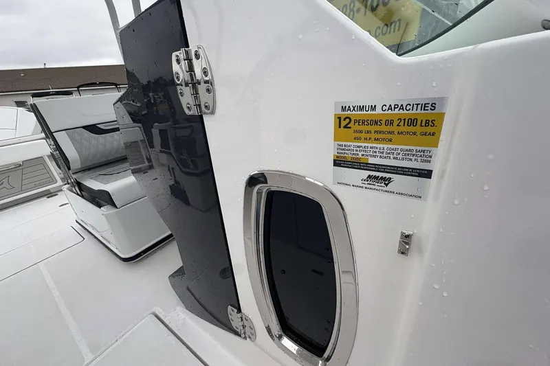 Slide: The Image of 2025 Blackfin 252 DC boat interior, capacity label for 12 people or 2100 lbs. - 15
