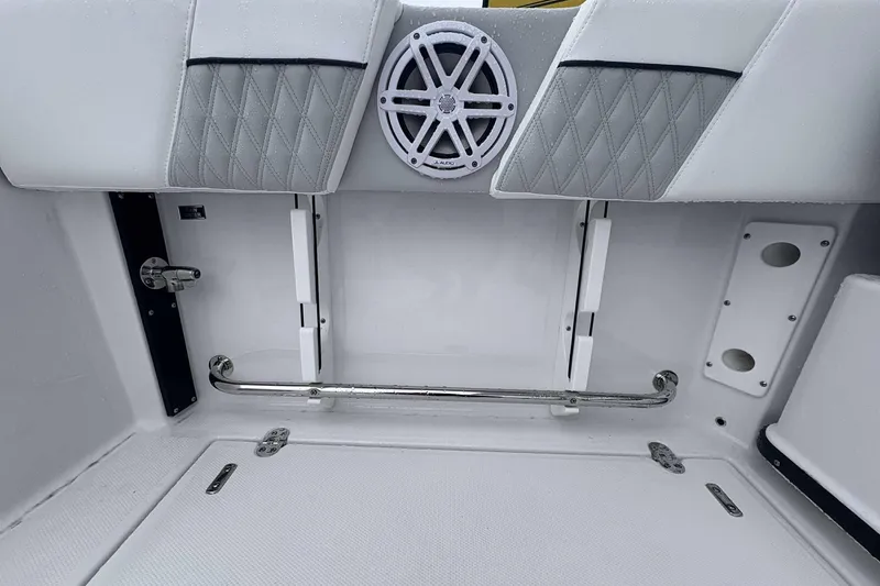 Slide: The Image of 2025 Blackfin 252 DC boat interior with speaker and cushioned seating. - 19
