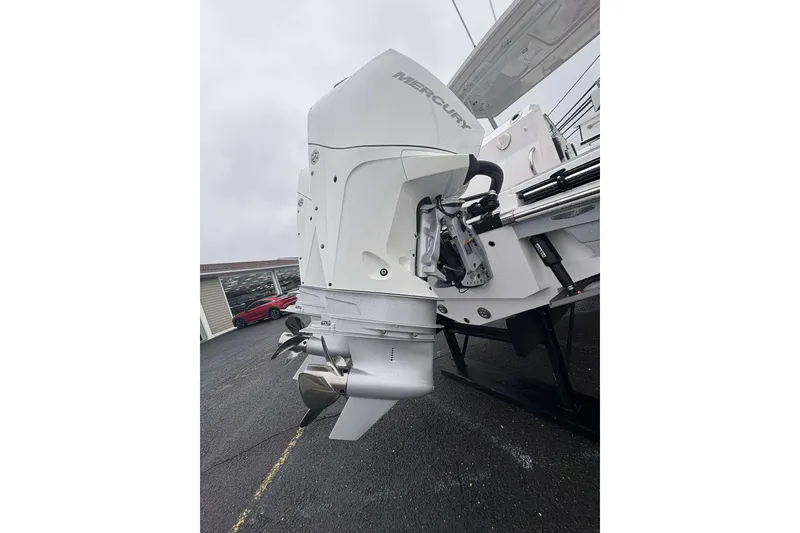 Slide: The Image of 2025 Blackfin 252 DC boat with Mercury outboard engine, displayed on a trailer. - 28