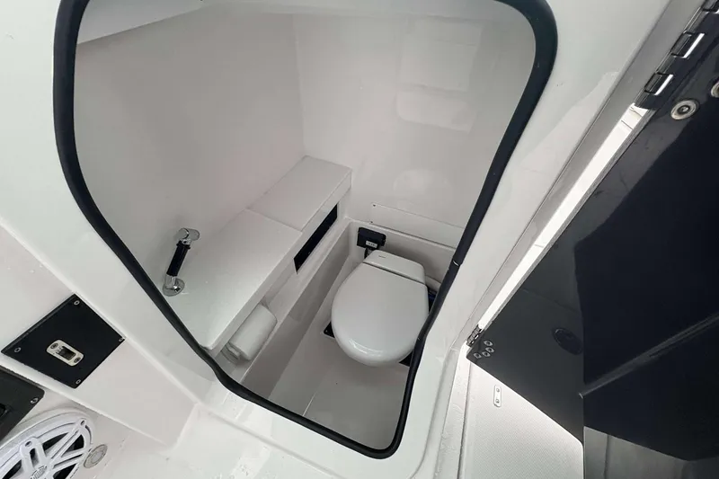 Slide: The Image of 2025 Blackfin 252 DC boat interior with compact marine toilet. - 9